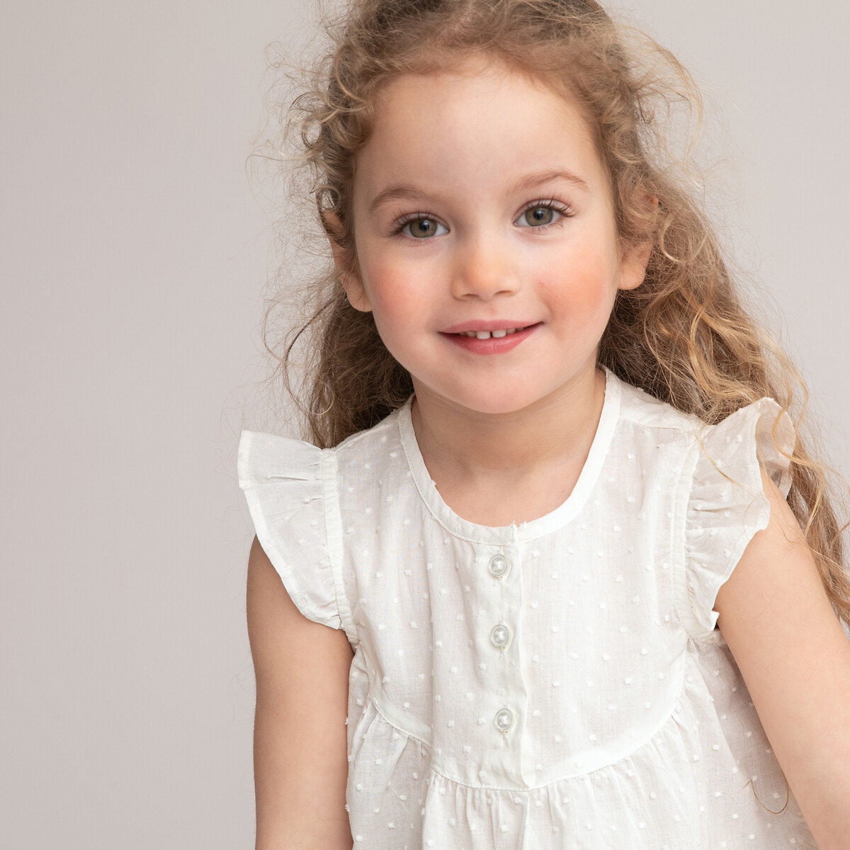 Αμάνικη μπλούζα με βολάν και ανάγλυφα πουά