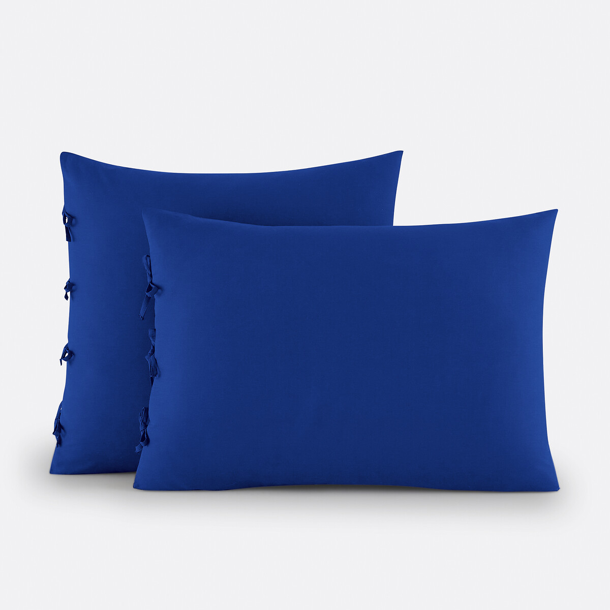 Βαμβακερή μονόχρωμη μαξιλαροθήκη με φιογκάκια 50x70 cm