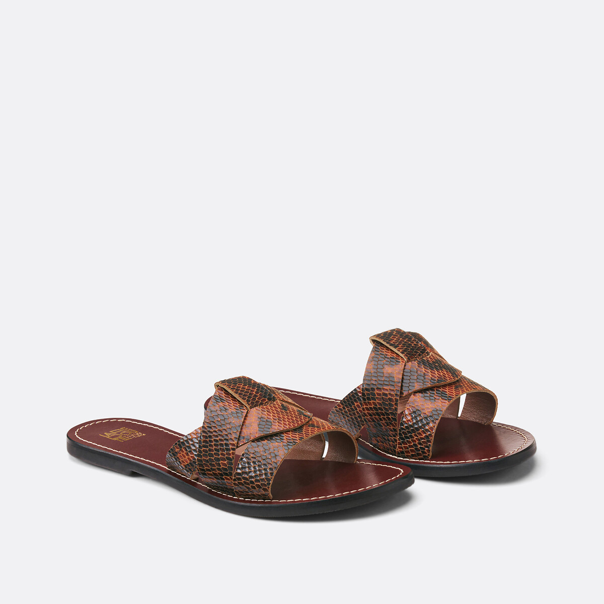  Φλατ δερμάτινα μιούλ με snake print 2025